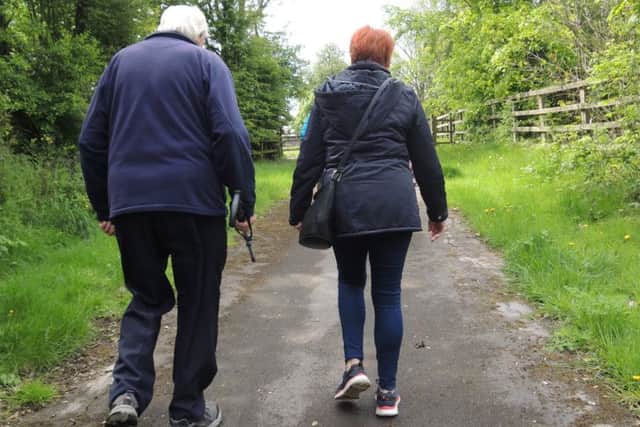 STROLL: A group combating social isolation did a led walk around Oakwell Hall in Birstall.