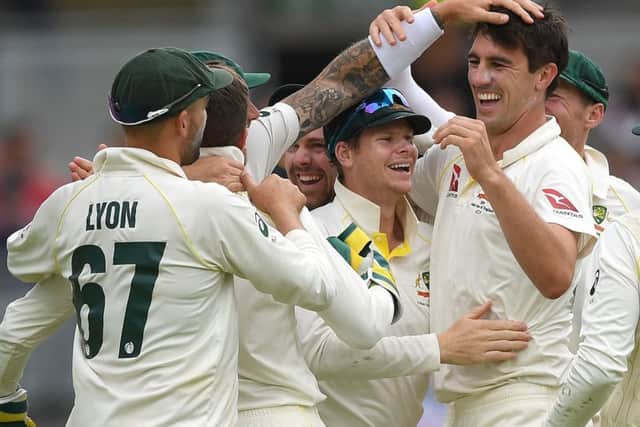 Pat Cummings of Australia celebrates with Steve Smith and team-mates after taking the final wicket of Chris Woakes of England to win the 1st Specsavers Ashes Test between England and Australia at Edgbaston. (Picture: Gareth Copley/Getty Images)