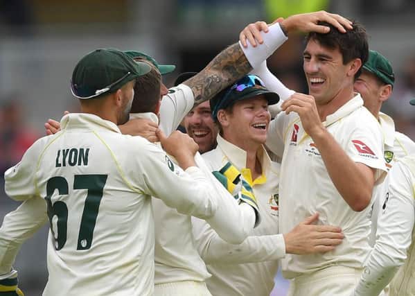 Pat Cummings of Australia celebrates with Steve Smith and team-mates after taking the final wicket of Chris Woakes of England to win the 1st Specsavers Ashes Test between England and Australia at Edgbaston. (Picture: Gareth Copley/Getty Images)