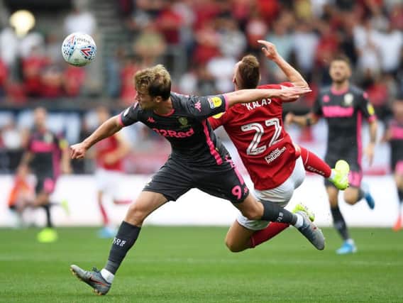 TOUGHER: Leeds United striker Patrick Bamford, pictured challenging Bristol City's Tomas Kalas, says he has strengthened up over the summer and will expect nothing from referees. Photo by Alex Davidson/Getty Images.