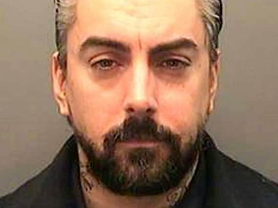 Ian Watkins is accused of possessing a mobile phone in prison