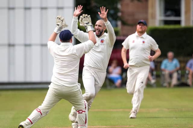 Fahan Khan, of North Leeds, celebrates taking a wicket in Sunday's Waddilove Cup final but it wasn't enough to deny victors, Burley-in-Wharfedale. PIC: John Heald