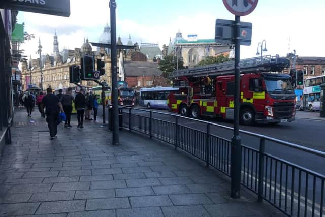 Fire crews leaving the scene of a building fire on Harper Street.