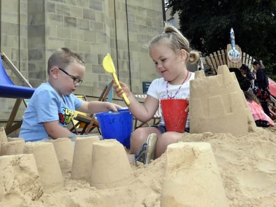 Archie Batty, four, and sister Elsie, three, of Crofton play at last year's City Beach