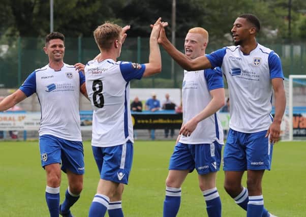 Guiseley players celebrate during their victory over King's Lynn Town last weekend. Picture: Alex Daniel.