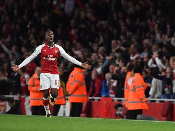BRING IT ON: Eddie Nketiah celebrates scoring his and Arsenal's second goal which sealed a 2-1 win against Norwich City after extra time at the Emirates in the EFL Cup in October 2017. Now the 20-year-old striker is relishing the pressure of a promotion quest with Leeds United. Picture BEN STANSALL/AFP/Getty Images.