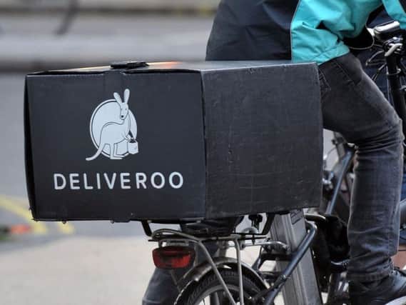 A Deliveroo cyclist (PA)