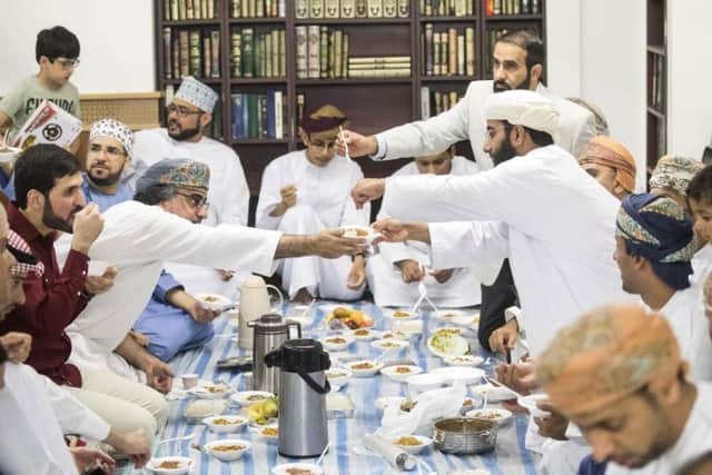 Worshippers share food following the 2018 Eid-al Fitr prayer, which marks the end of Ramadan, at Leeds Grand Mosque (Photo: PA).