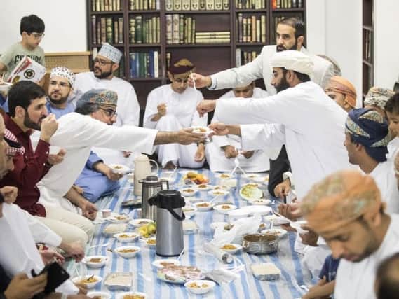Worshippers share food following the 2018 Eid-al Fitr prayer, which marks the end of Ramadan, at Leeds Grand Mosque (Photo: PA).