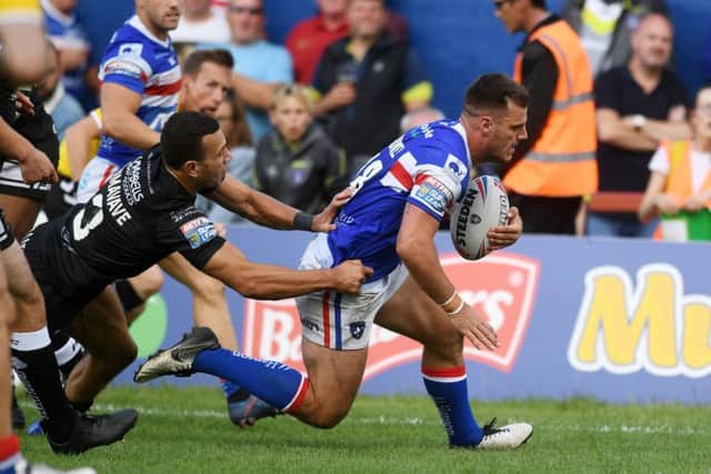 Wakefield's Joe Arundel goes over to score against Hull. PIC: Jonathan Gawthorpe/JPIMedia