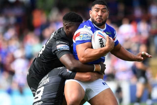 Wakefield's Kelepi Tanginoa is tackled by Hull's Danny Houghton and Masi Matongo.
PIC: Jonathan Gawthorpe
