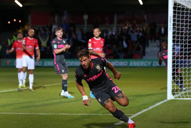 ON OUR WAY: Leeds United defender and captain for the night Gaetano Berardi races away to celebrate his side's second goal in the 3-0 win at Salford City in the Carabao Cup first round. Photo by Alex Livesey/Getty Images.