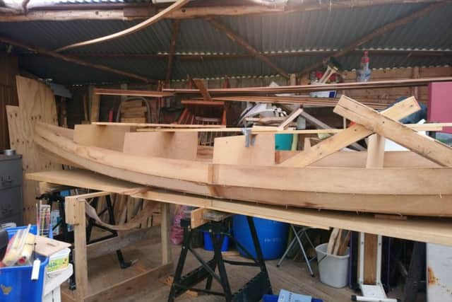 Addi and Little Lobster's canoe under construction
