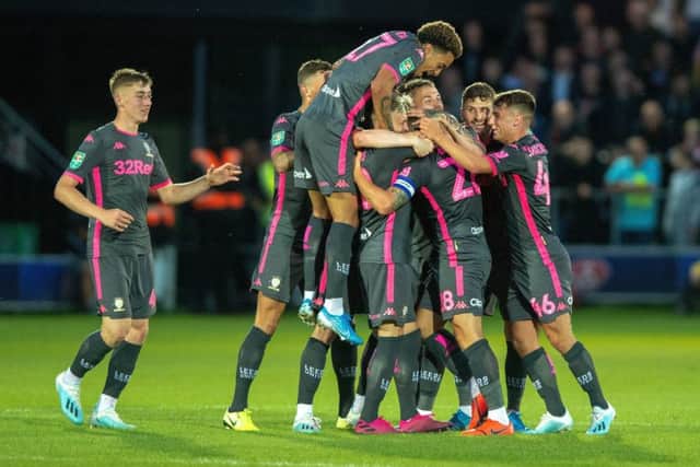 Gaetano Berardi celebrates scoring Leeds United's second goal at Salford City.