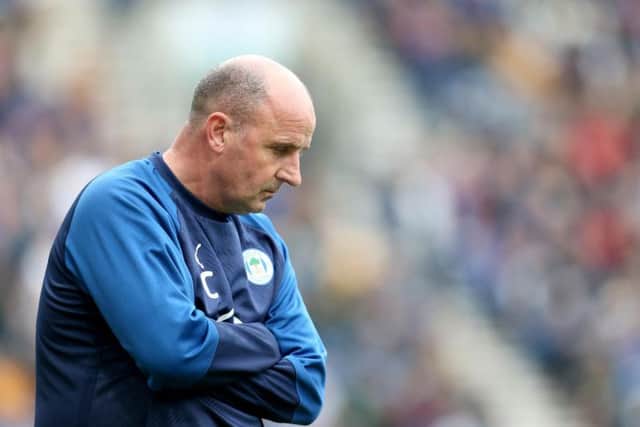 NOT IMPRESSED: Wigan Athletic boss Paul Cook. Photo by Lewis Storey/Getty Images.