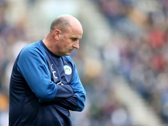 NOT IMPRESSED: Wigan Athletic boss Paul Cook. Photo by Lewis Storey/Getty Images.