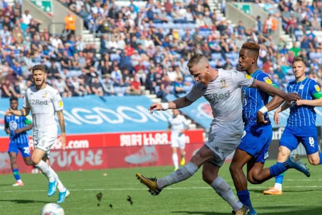 Leeds United midfielder Adam Forshaw fires wide against Wigan Athletic.