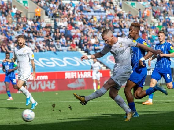 Leeds United midfielder Adam Forshaw fires wide against Wigan Athletic.