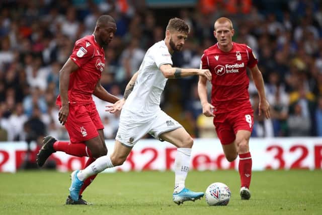 Leeds United's Mateusz Klich (centre) in action with Nottingham Forest's Samba Sow (left) and Ben Watson during the Sky Bet Championship match at Elland Road, Leeds. PRESS ASSOCIATION Photo. Picture date: Saturday August 10, 2019. See PA story SOCCER Leeds. Photo credit should read: Tim Goode/PA Wire. RESTRICTIONS: EDITORIAL USE ONLY No use with unauthorised audio, video, data, fixture lists, club/league logos or "live" services. Online in-match use limited to 120 images, no video emulation. No use in betting, games or single club/league/player publications.