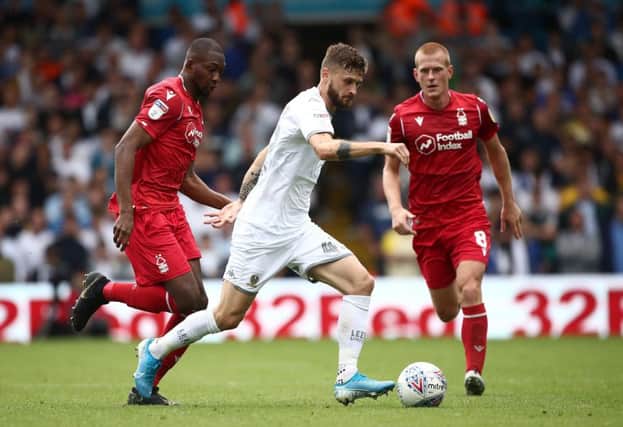 Leeds United's Mateusz Klich (centre) in action with Nottingham Forest's Samba Sow (left) and Ben Watson during the Sky Bet Championship match at Elland Road, Leeds. PRESS ASSOCIATION Photo. Picture date: Saturday August 10, 2019. See PA story SOCCER Leeds. Photo credit should read: Tim Goode/PA Wire. RESTRICTIONS: EDITORIAL USE ONLY No use with unauthorised audio, video, data, fixture lists, club/league logos or "live" services. Online in-match use limited to 120 images, no video emulation. No use in betting, games or single club/league/player publications.