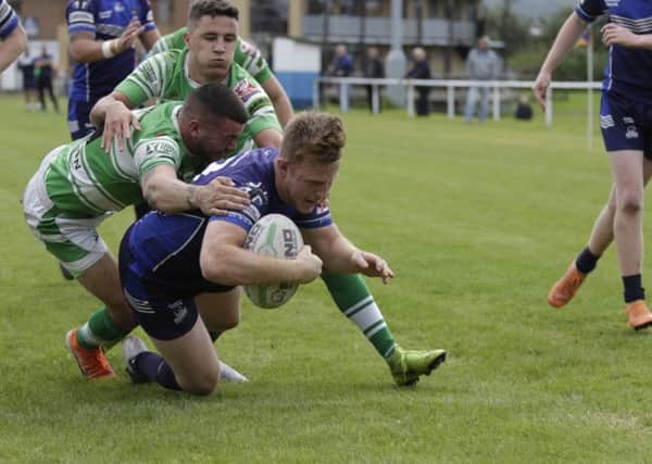 Liam Brown dives for the line in Hunslet Warriors' 28-12 win over Dewsbury Celtic.