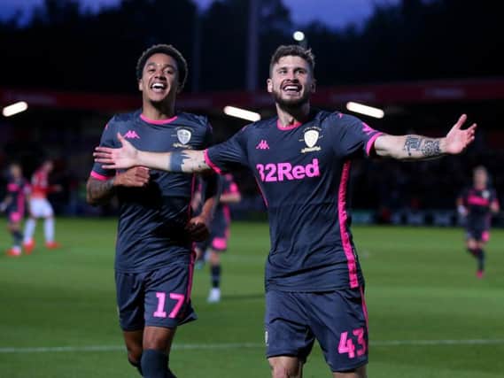 GOING THROUGH: Helder Costa and Mateusz Klich celebrate Klich's strike in Leeds United's 3-0 win at Salford City in the Carabao Cup first round. Photo by Alex Livesey/Getty Images.