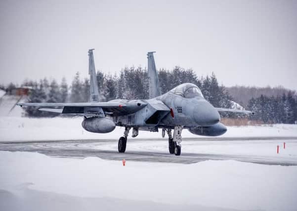 DEDICATION: Camera club member Ian Sykes has been photographing Phantom jets in Japan at minus 24 degrees.