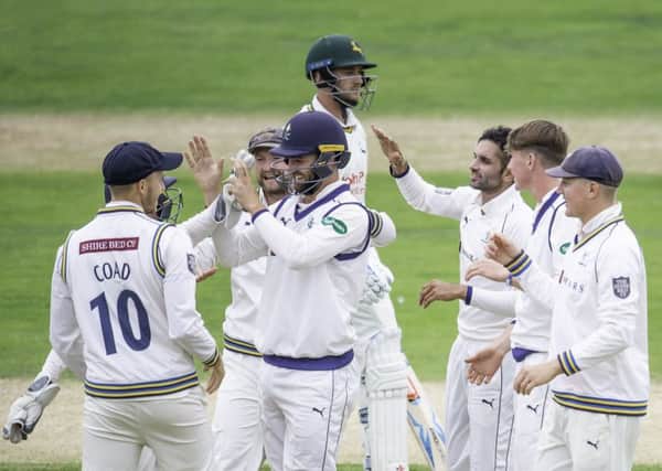 Yorkshire's Keshav Maharaj celebrates the wicket of Nottinghamshire's Joe Clarke.