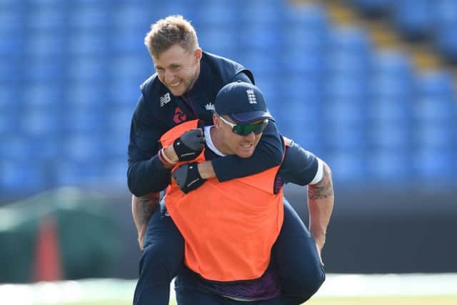 RIDE YOUR LUCK: Yorkshires England Test captain Joe Root takes a piggy back from opening batsman Jason Roy, who faces a further concussion assessment at Headingley this morning. Picture: Stu Forster/Getty Images.