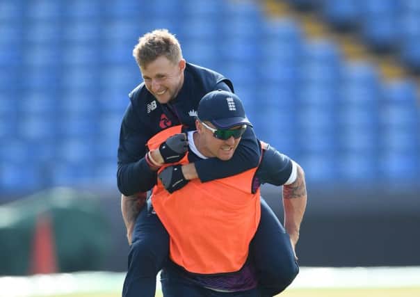 RIDE YOUR LUCK: Yorkshires England Test captain Joe Root takes a piggy back from opening batsman Jason Roy, who faces a further concussion assessment at Headingley this morning. Picture: Stu Forster/Getty Images.