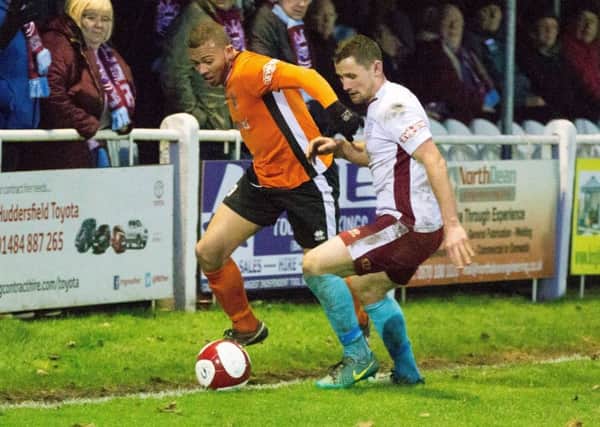 Guiseley's Aaron Martin in action for Brighouse Town.