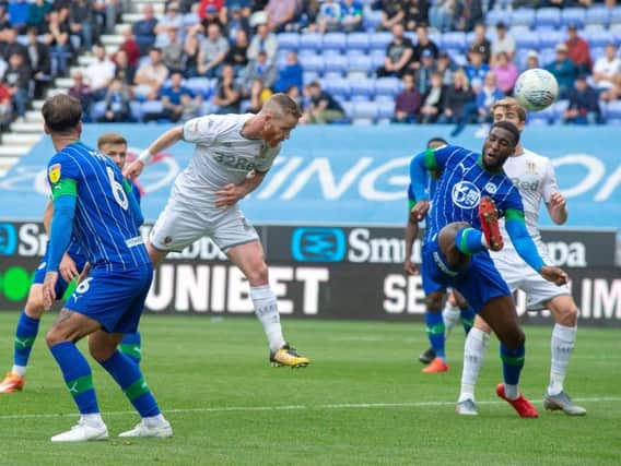 SO CLOSE: Leeds United midfielder Adam Forshaw thumps a header against the post in Saturday's 2-0 win at Wigan Athletic, setting up the opening goal for Patrick Bamford as a result. Picture by Bruce Rollinson.