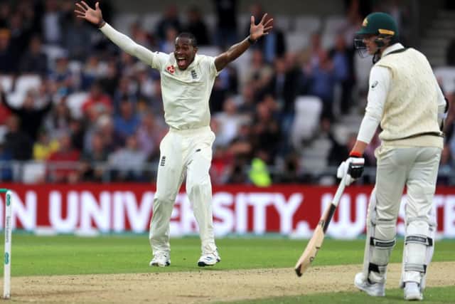 England's Jofra Archer celebrates taking the wicket of Australia's Nathan Lyon.