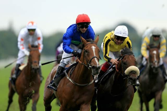 Wells Farhh Go and David Allan (red cap) won the Acomb Stakes at York's Ebor festival two years ago.