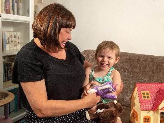 Connie Annakin, aged three, who has been diagnosed with the fatal genetic condition Batten disease, pictured with mother Caroline Day. Picture: Bruce Rollinson