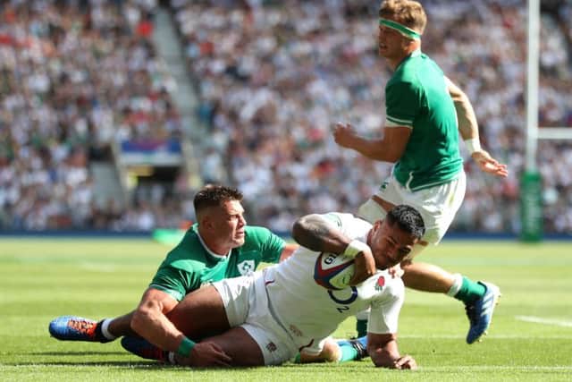 England's Manu Tuilagi scores his side's third try of the game at Twickenham. Picture: David Davies/PA