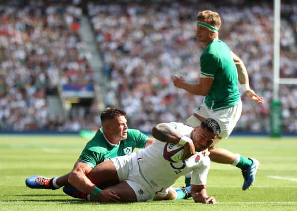 England's Manu Tuilagi scores his side's third try of the game at Twickenham. Picture: David Davies/PA