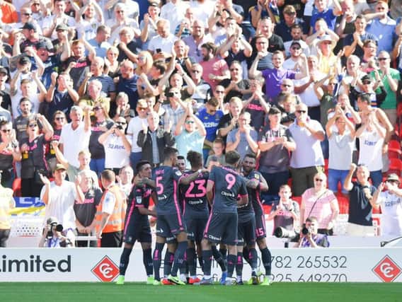 THRIVING: Leeds United celebrate Gjanni Alioski's strike in front of nearly 3,000 travelling Whites fans as part of Saturday's 3-0 win at Stoke City.