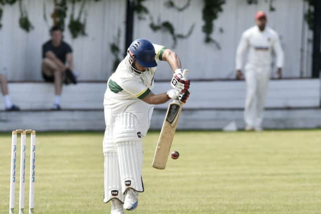Wrenthorpe's Irfan Amjad is forced onto his toes from this delivery from Matty Waite, of Methley. PIC: Steve Riding