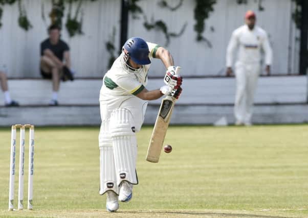 Wrenthorpe's Irfan Amjad is forced onto his toes from this delivery from Matty Waite, of Methley. PIC: Steve Riding