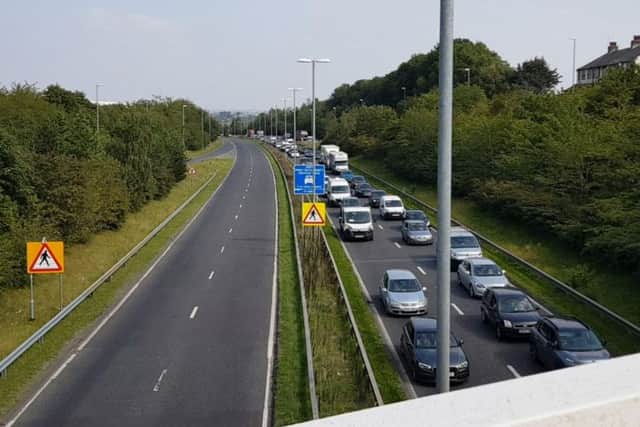 Traffic on Stanningley Bypass after a car crashed into the central reservation