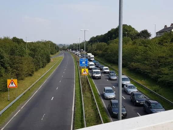 Traffic on Stanningley Bypass after a car crashed into the central reservation