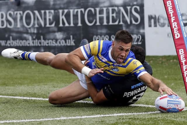 Joel Moon touches down for his second try against London Broncos last season.
