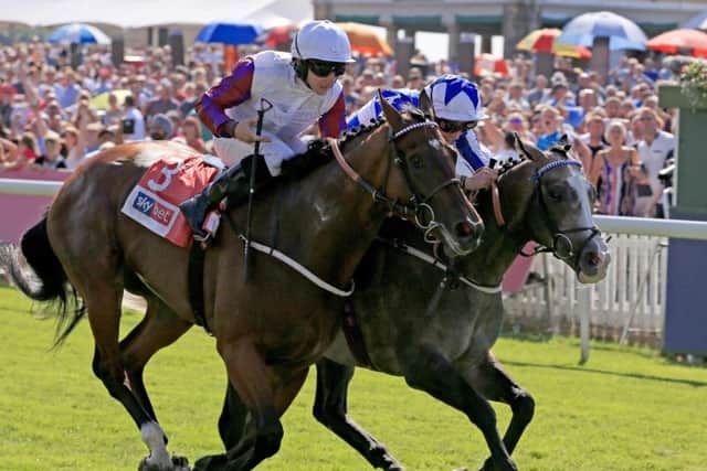 Shine So Bright (Right) ridden by Silvestre De Souza wins the Sky Bet City of York Stakes ahead of Laurens ridden by P J McDonald during Sky Bet Ebor Day of the Yorkshire Ebor Festival at York Racecourse. Pic: PA