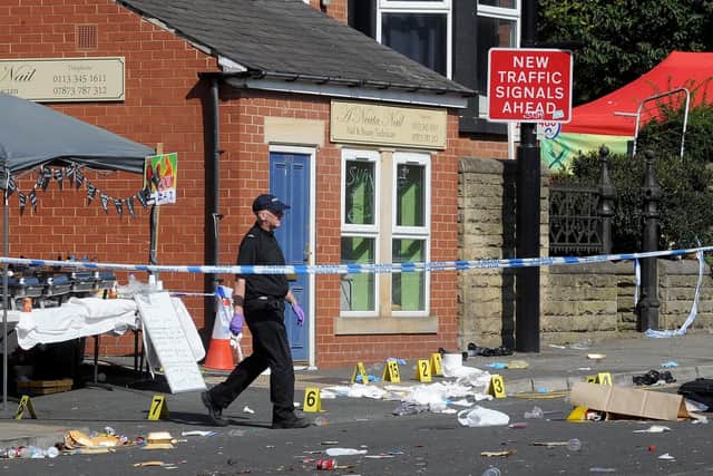 Police and Forensic officers at the scene of a murder at Button Hill, Chapeltown Road, Leeds.26th August 2019.