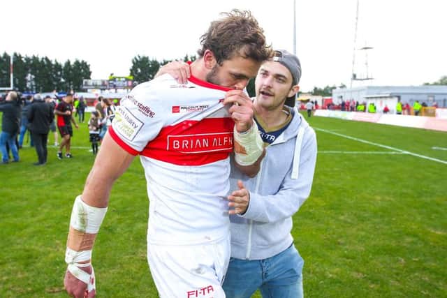 Hull KR's Josh Mantellato is consoled by a fan after the club's relegation in 2016.