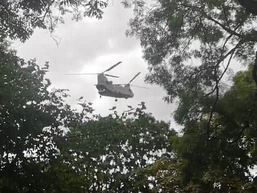 The helicopter taking off.