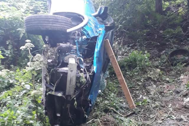 A woman was trapped inside her car after it overturned down a ditch in Morley (Photo: WYP)