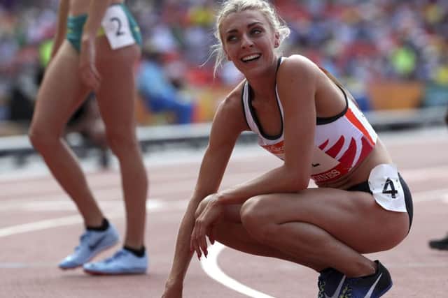 England's Alexandra Bell reacts after her women's 800m heat at Carrara Stadium during the 2018 Commonwealth Games on the Gold Coast, Australia, Thursday, April 12, 2018. AP Photo/Mark Schiefelbein.