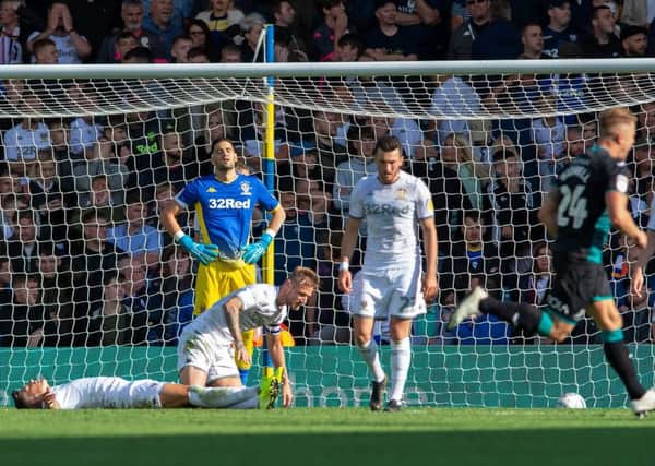 Leeds United's players show their frustration after Swansea City's winning goal.